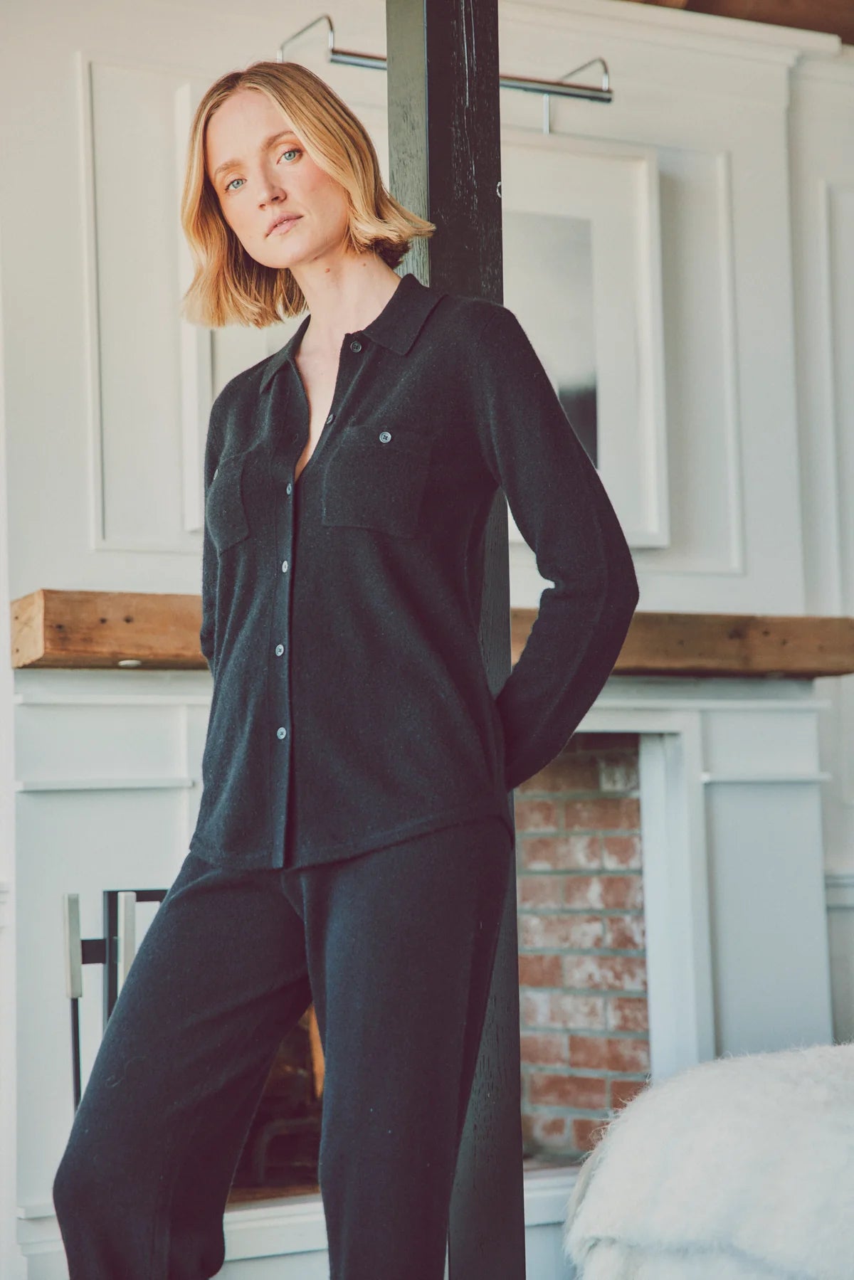 a model in a black cashmere loungewear set