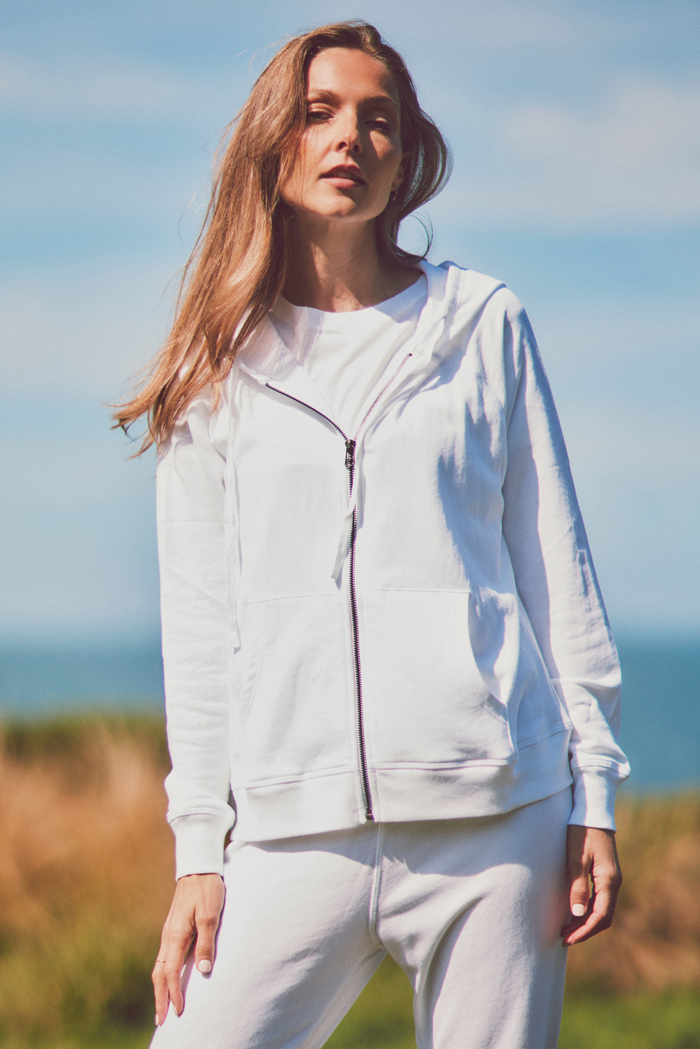 white hooded women’s sweatshirt