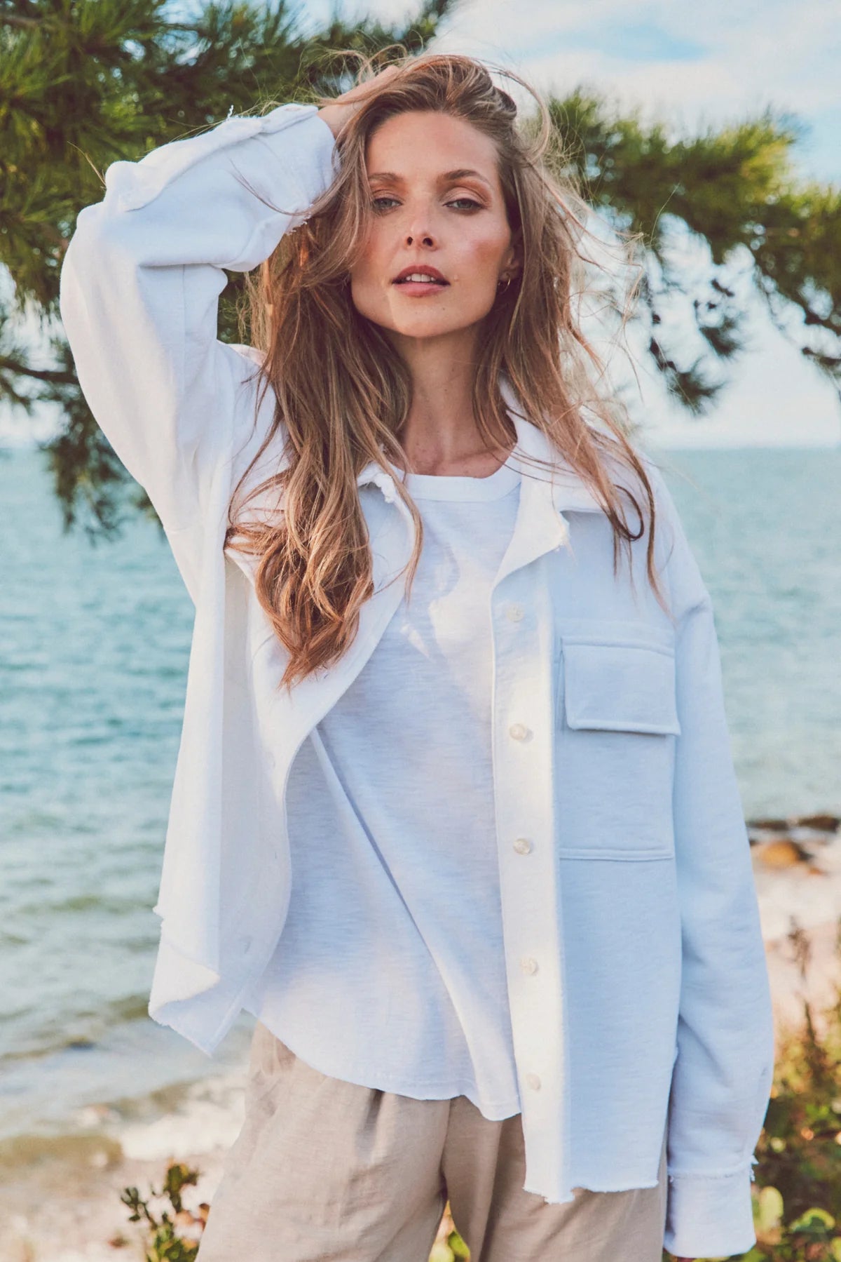 Woman in a white Dartmouth Jacket layered over a white tee