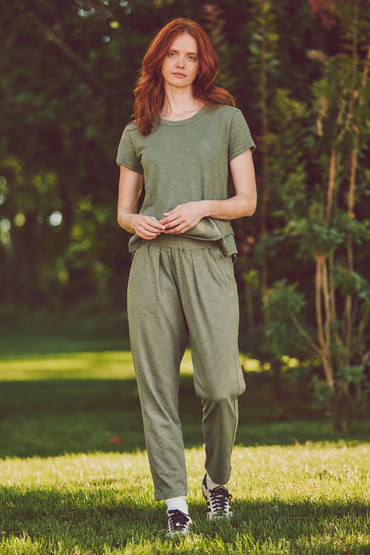 model wearing a matching olive loungewear set