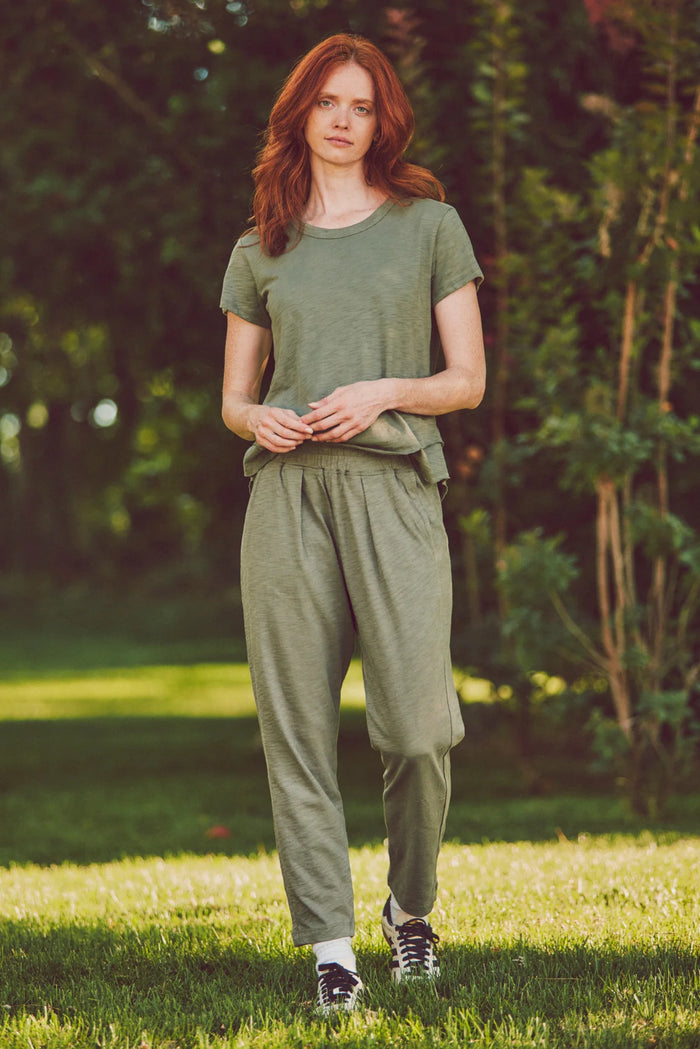 model wearing a matching olive loungewear set