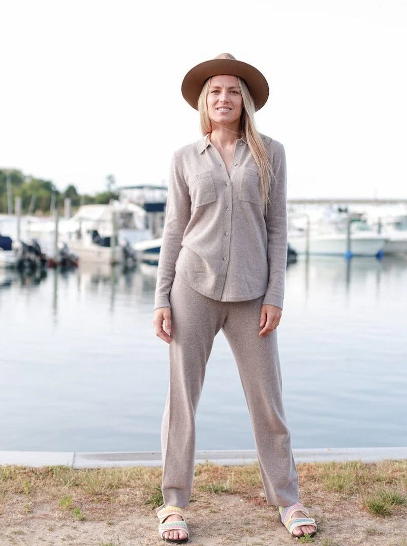 model by water in a beige loungewear set