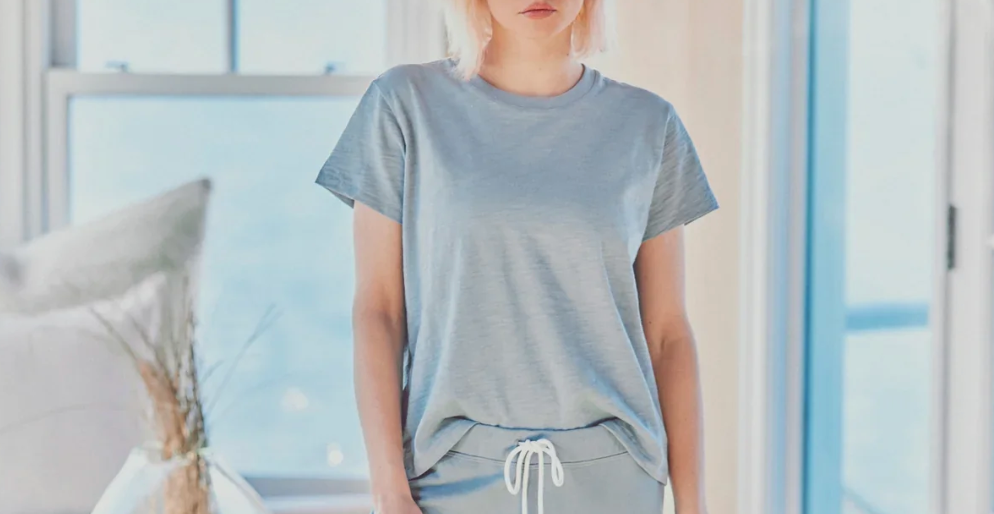 a model in a blue tee