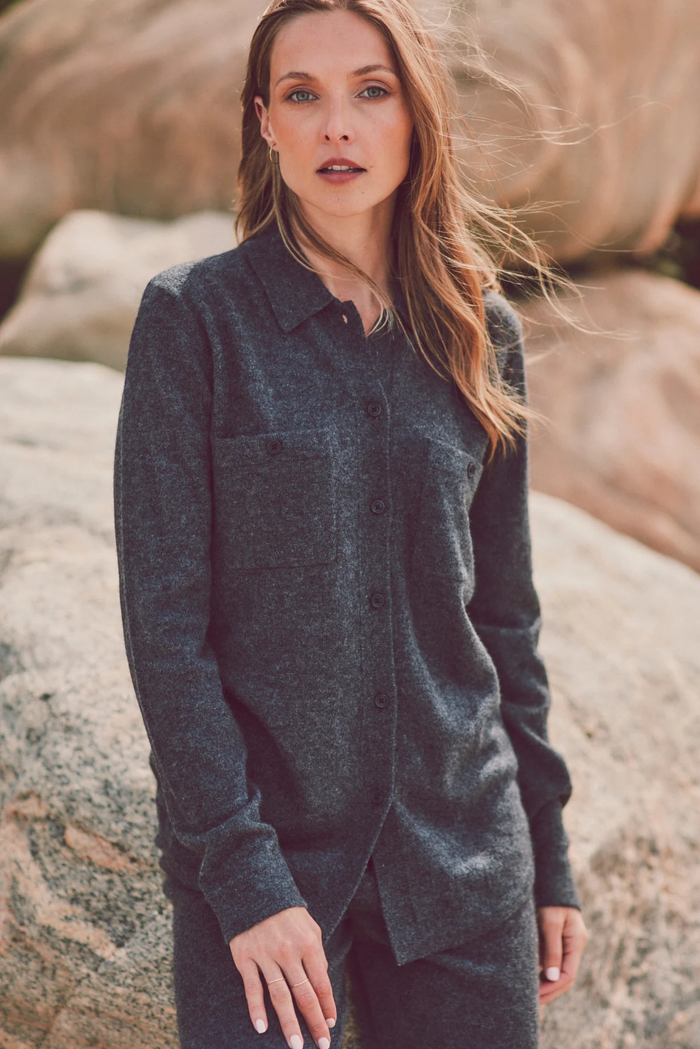 a model in a dark gray cashmere button-up