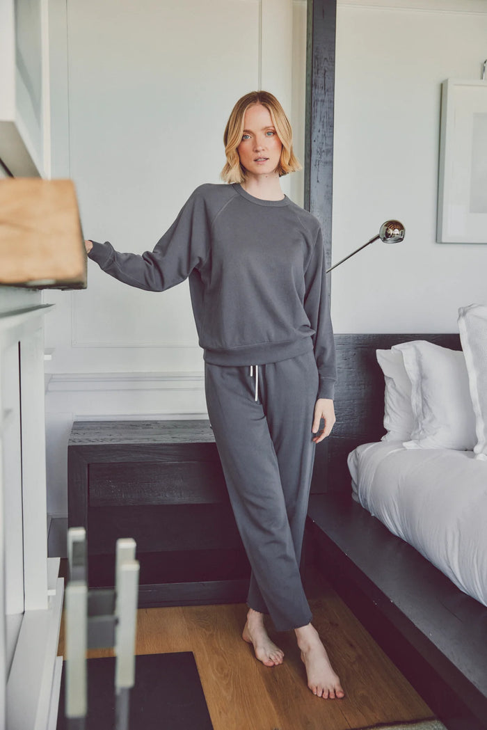 a model in a grey matching lounge set