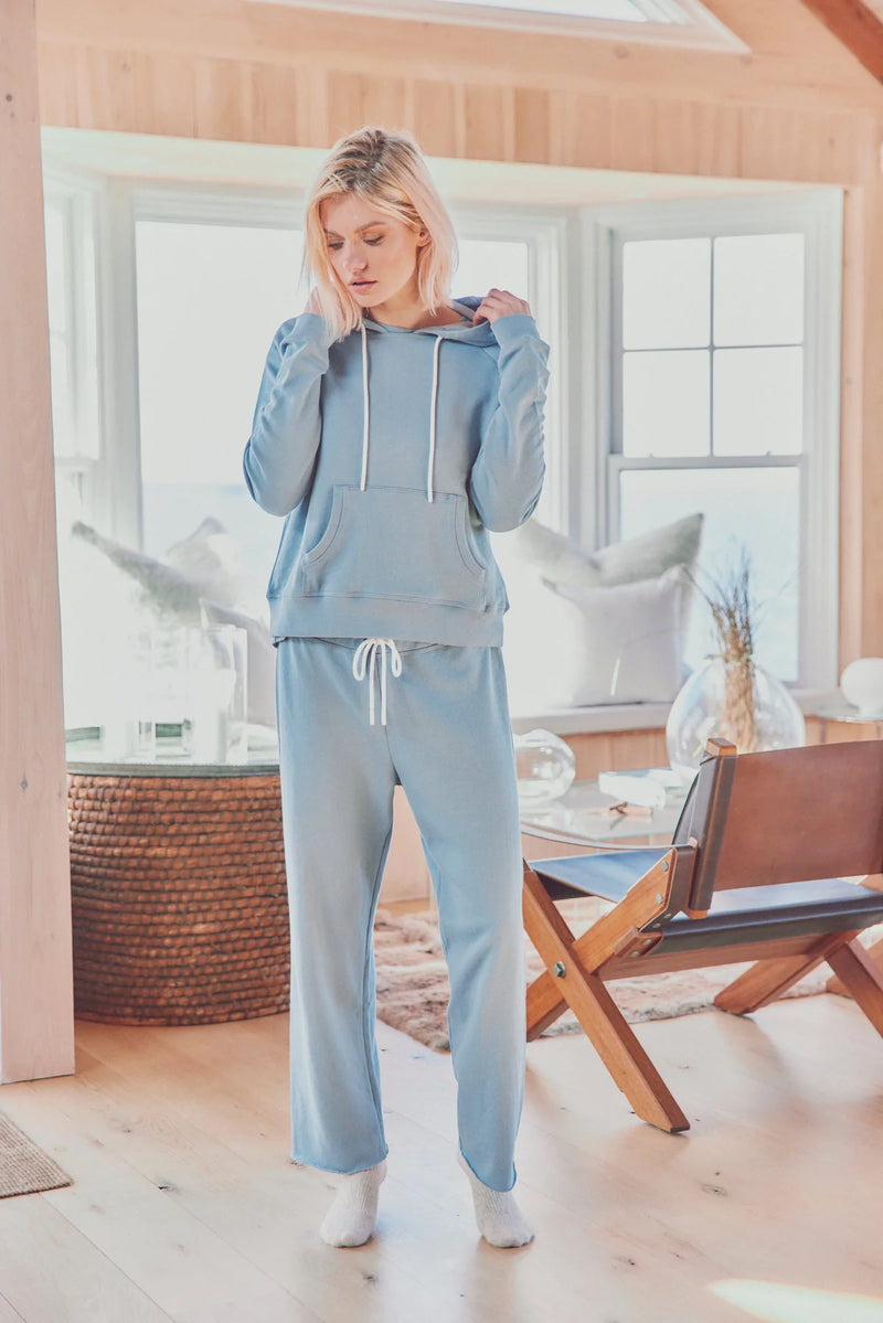 a model in a light blue jogger set