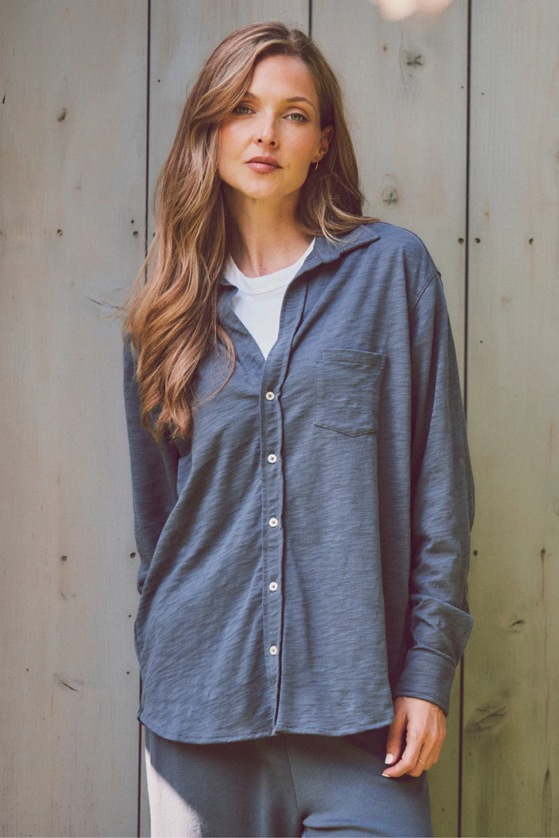 a model in a navy blue Emmit shirt