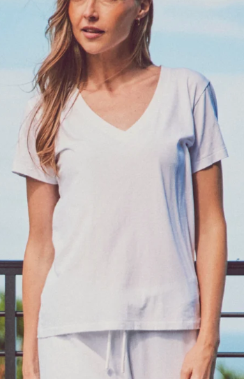 a model in a white v-neck tee