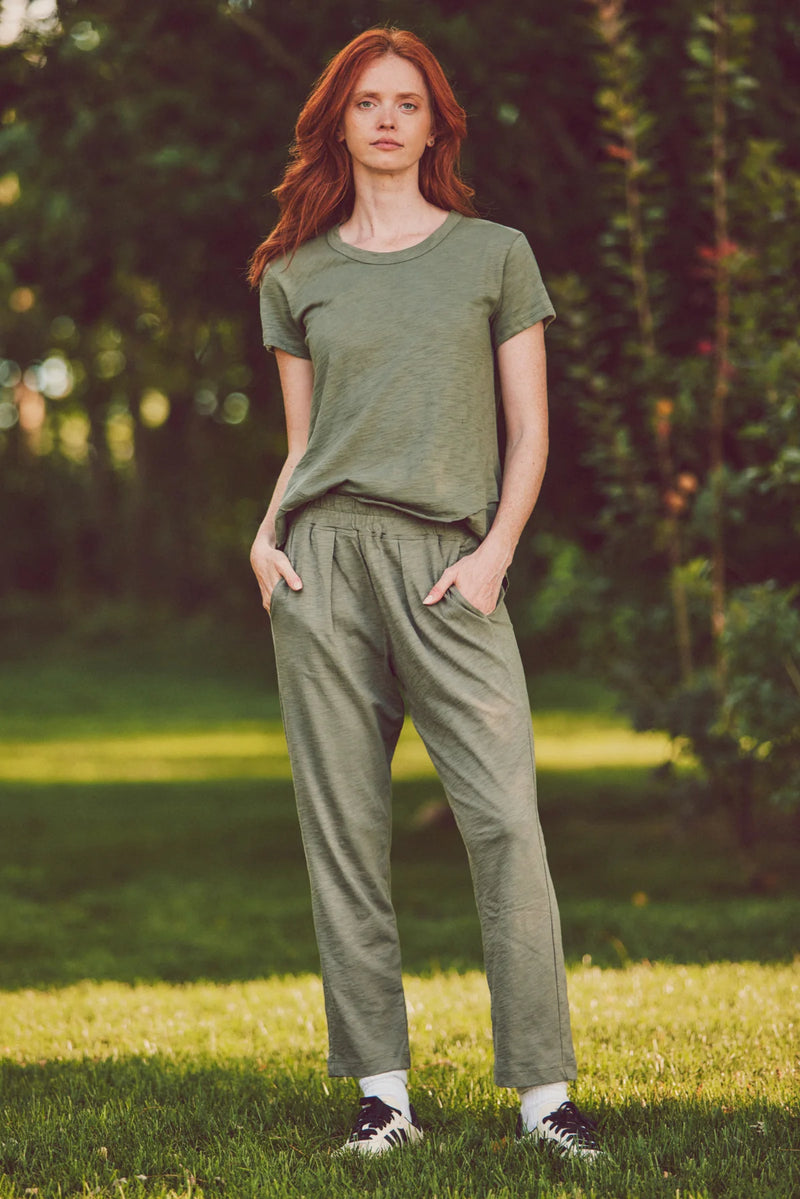 model posing in a matching olive loungewear set