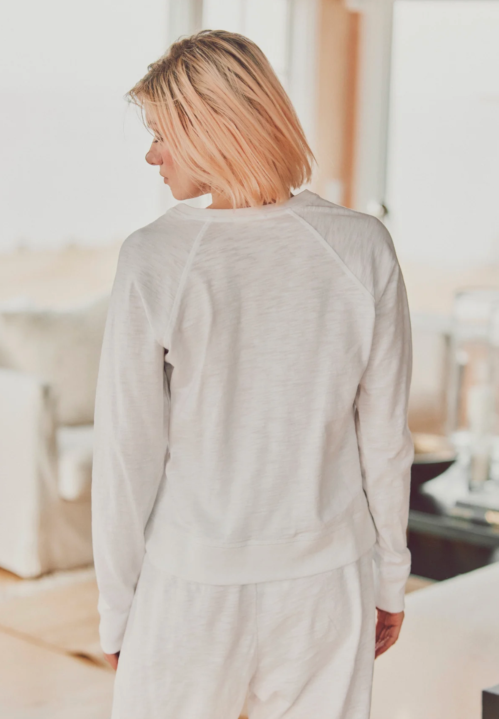 model showing back of white harbor long-sleeve tee