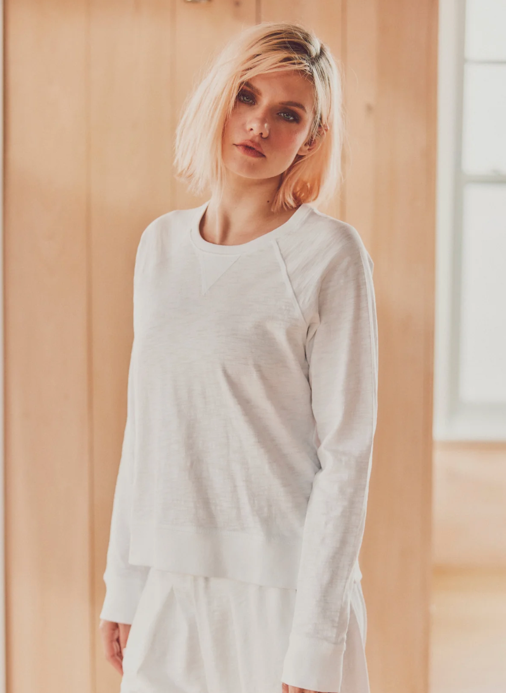 model wearing white harbor long-sleeve tee