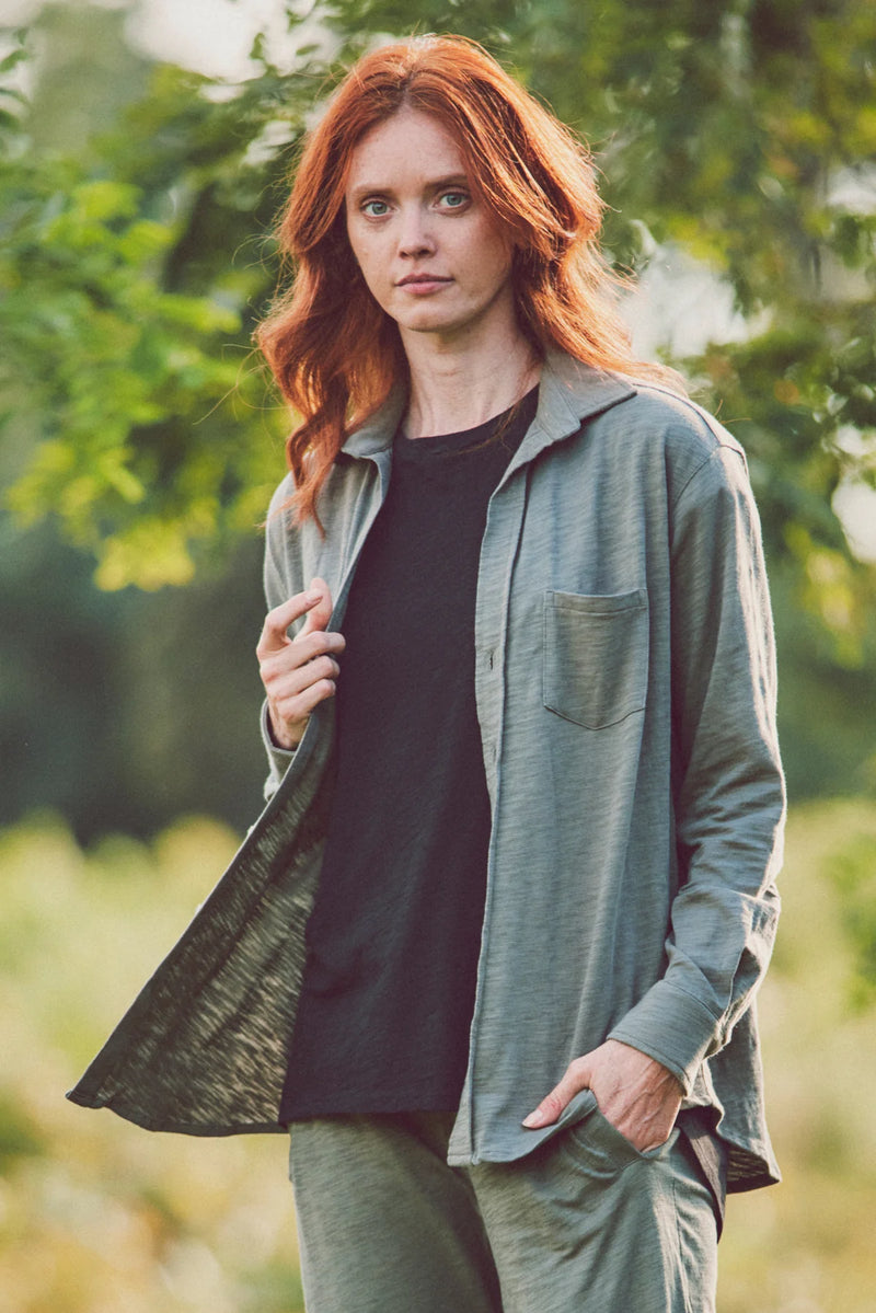 Woman wearing an olive-green button-down