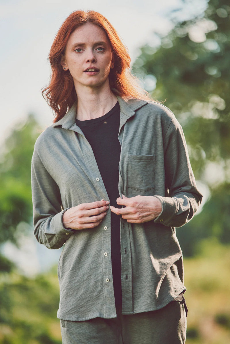 Woman in an olive-green button-down