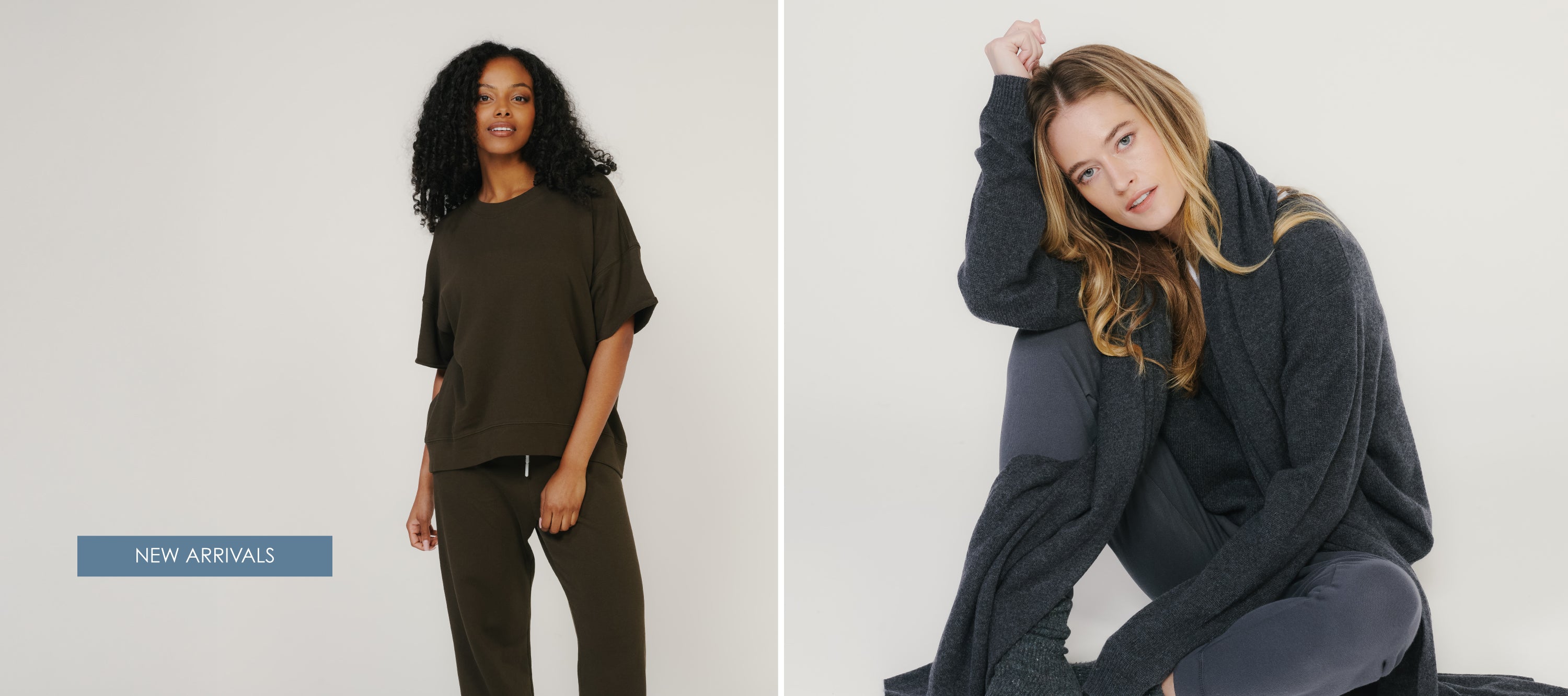 Model in charcoal cardigan wrap layered over joggers, seated in studio; text reads ‘New Arrivals.’